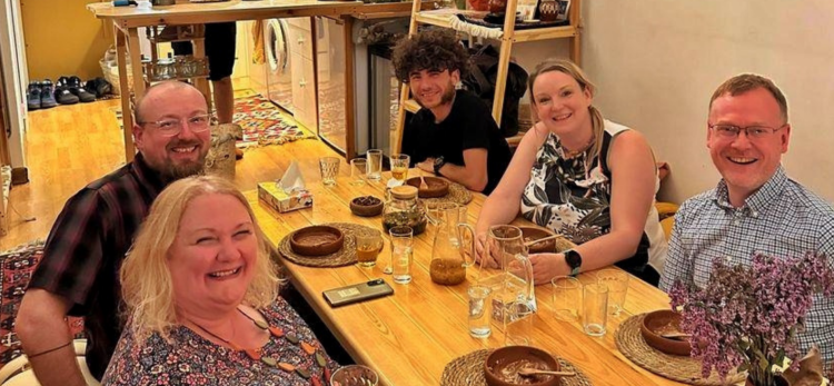 Azerbaijani chef preparing qutab on a traditional griddle