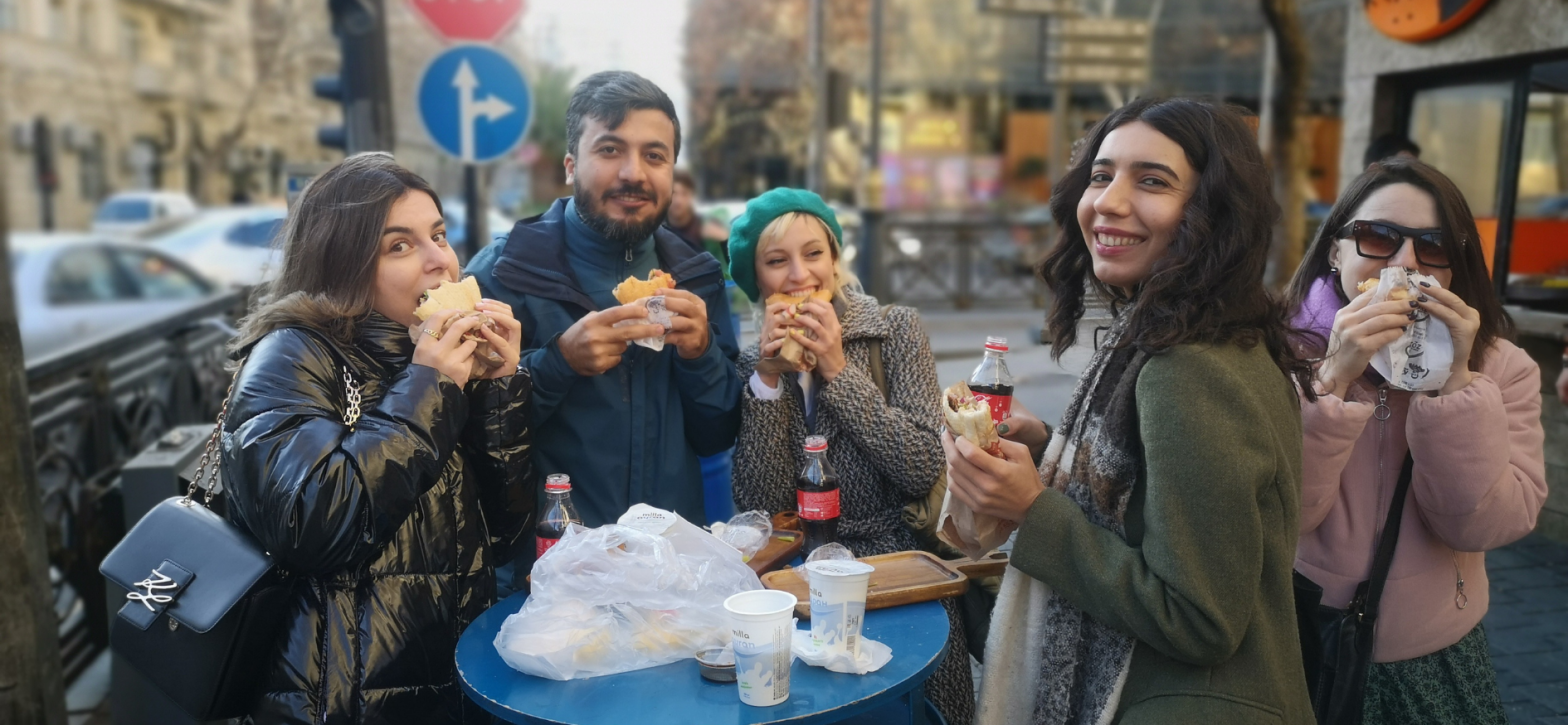 A group just outside of street vendor in our street food tour