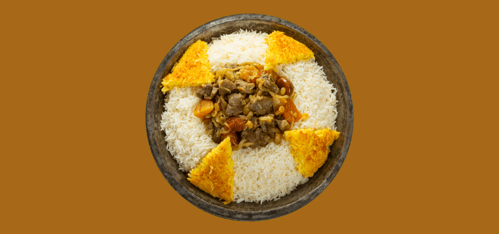 Traditional Ash-Gara plov in Baku with saffron rice and separate lamb topping